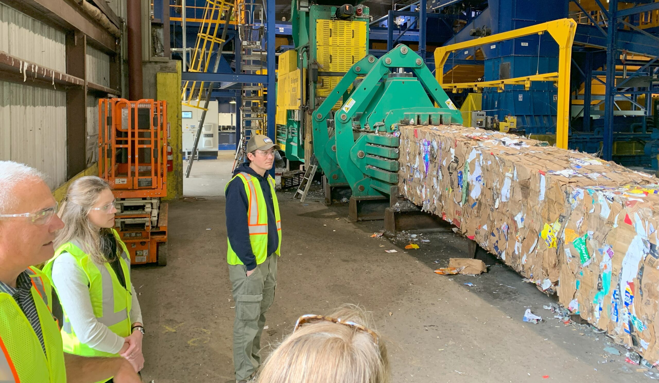 Visitors to the MRF observe bales of material being generated.